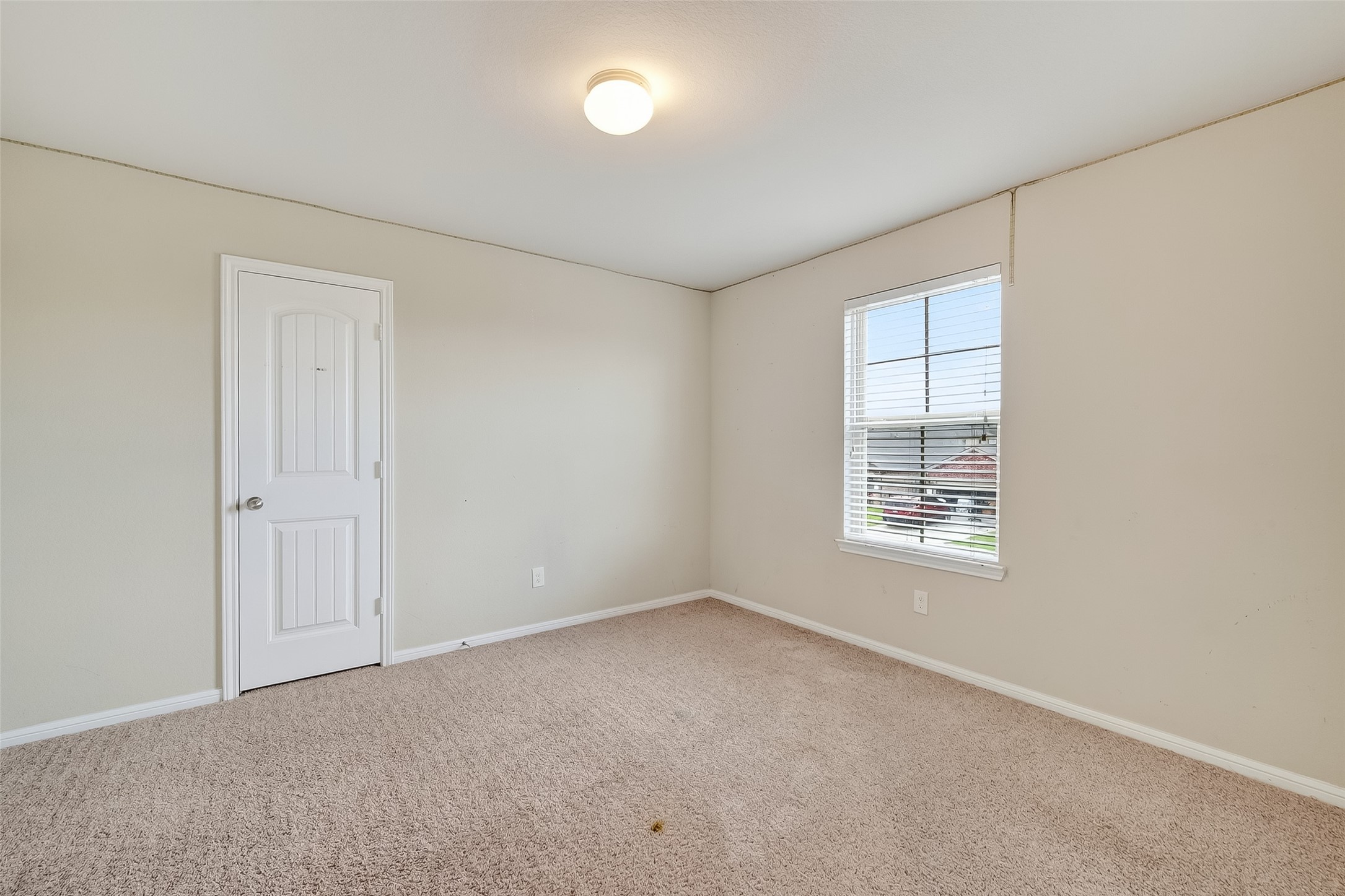 8007 Carillon Way Rosharon, TX 77583 - Photo 27 of 33 an empty room with windows