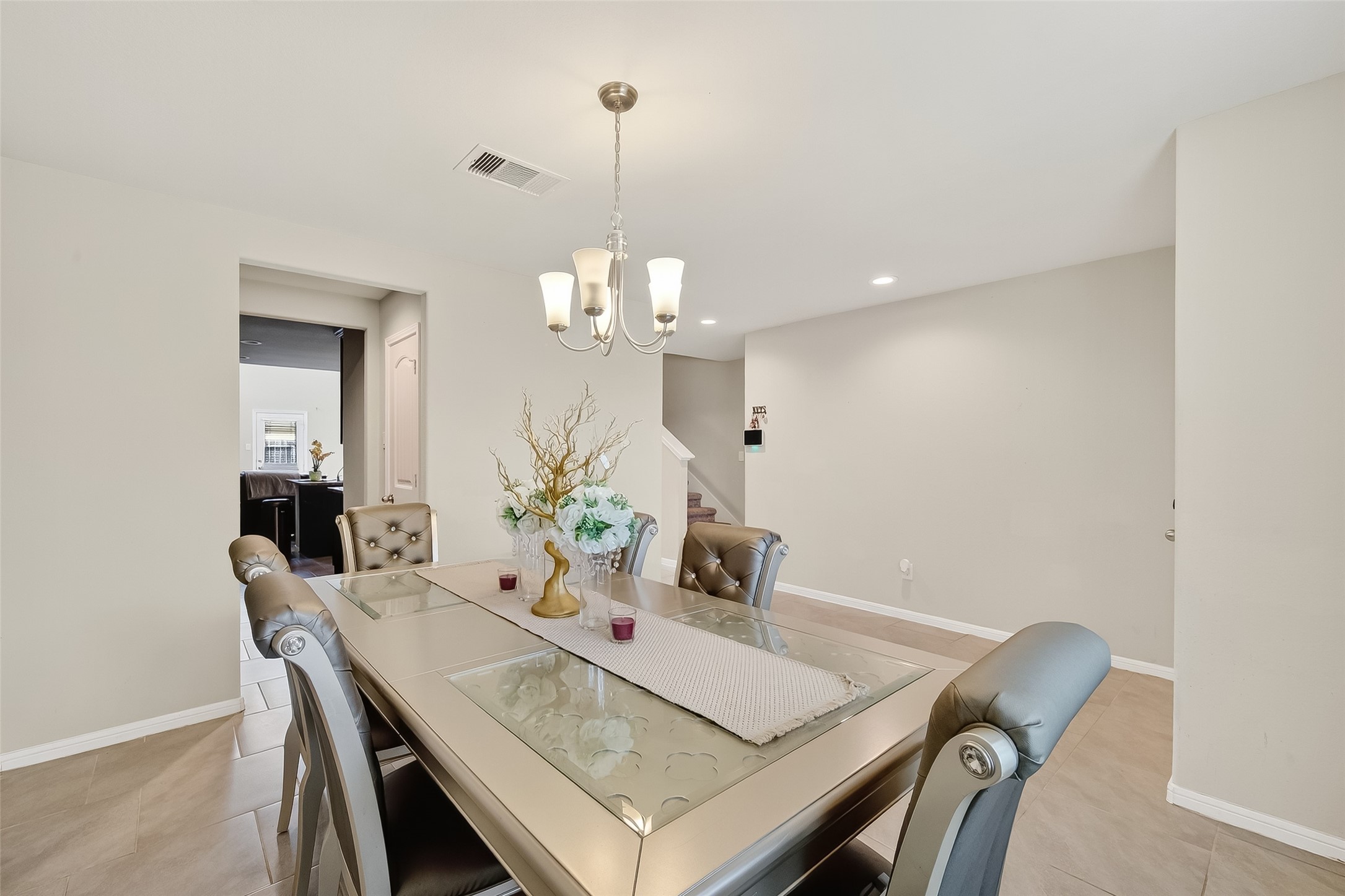 8007 Carillon Way Rosharon, TX 77583 - Photo 4 of 33 a view of a dining room with furniture and wooden floor
