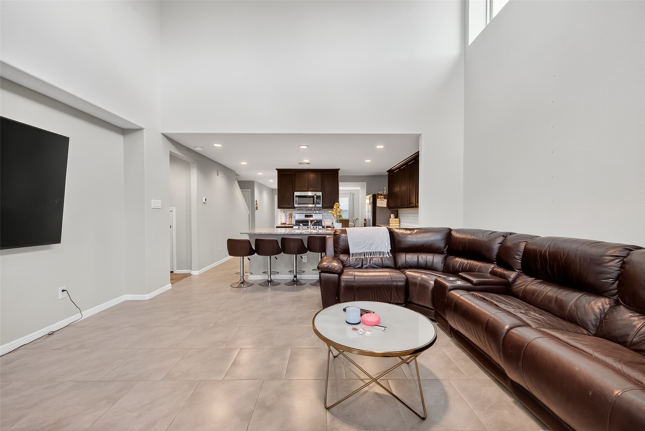 8007 Carillon Way Rosharon, TX 77583 - Photo 5 of 33 a living room with furniture and a flat screen tv