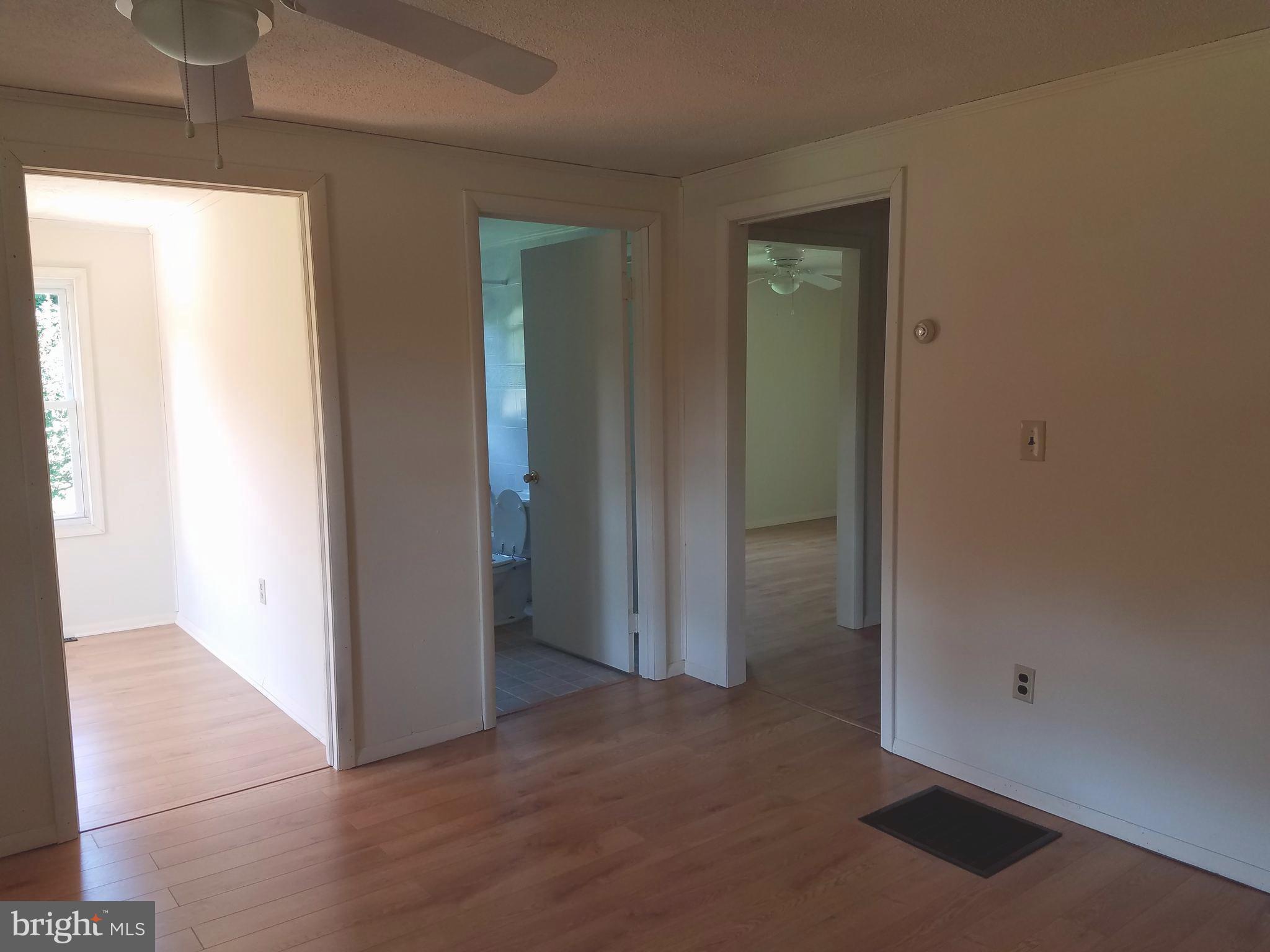 4449 Mountville Road Frederick, MD 21703 - Photo 12 of 29 Living Room doors to bedrooms and bathroom