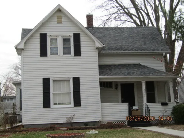 a front view of a house with garage