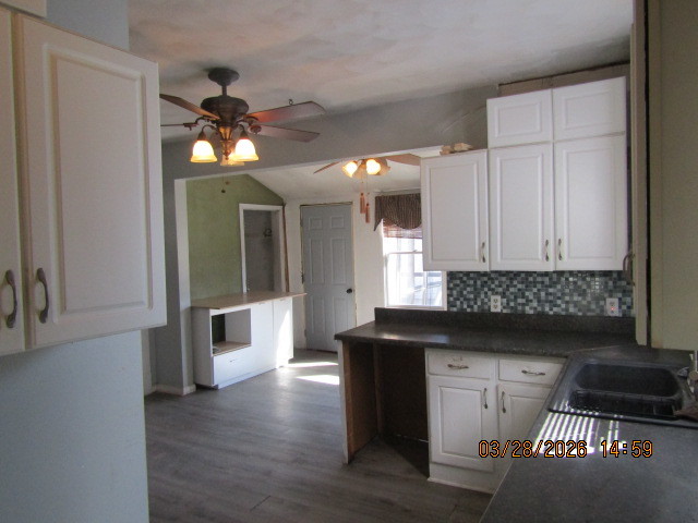 2334 18th Avenue Moline, IL 61265 - Photo 39 of 49 a kitchen with granite countertop a stove a sink and a refrigerator