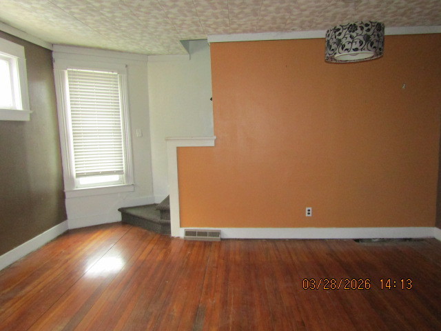 2334 18th Avenue Moline, IL 61265 - Photo 5 of 49 an empty room with wooden floor and windows