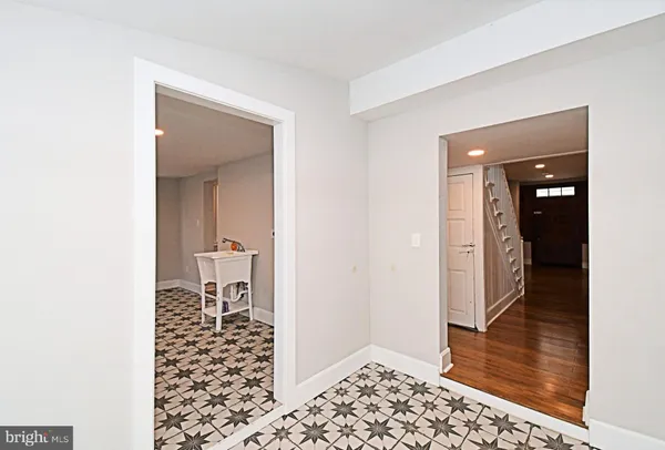 a view of a big room with wooden floor and a ceiling fan