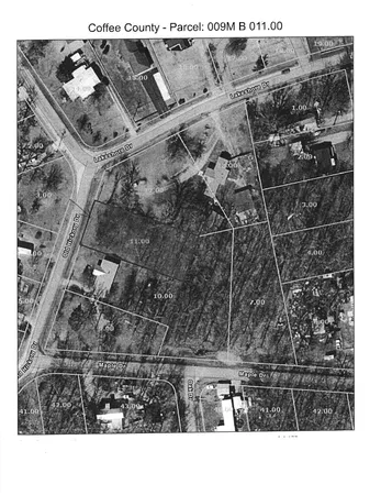 a black and white photo of a black gate
