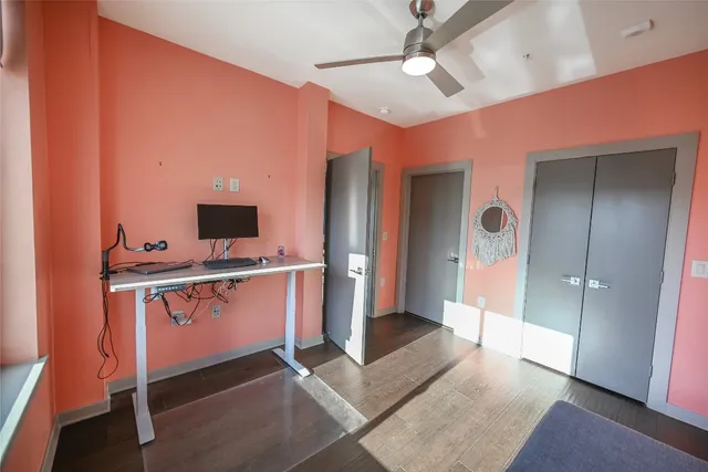 a view of an empty room with kitchen