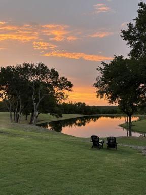 4251 Refuge Road Sherman, TX 75092 - Photo 19 of 40 a view of a lake with houses in the back