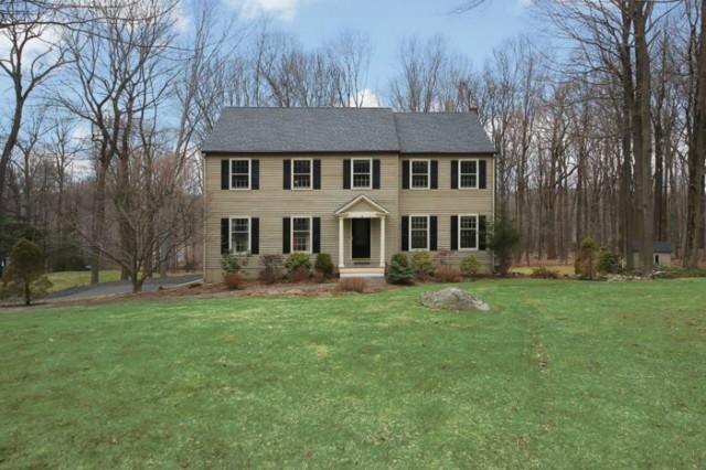 46 Caudatowa Drive Ridgefield, CT 06877 - Photo 1 of 1 a front view of a house with a garden