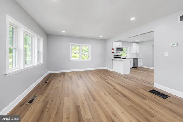 a view of kitchen and wooden floor