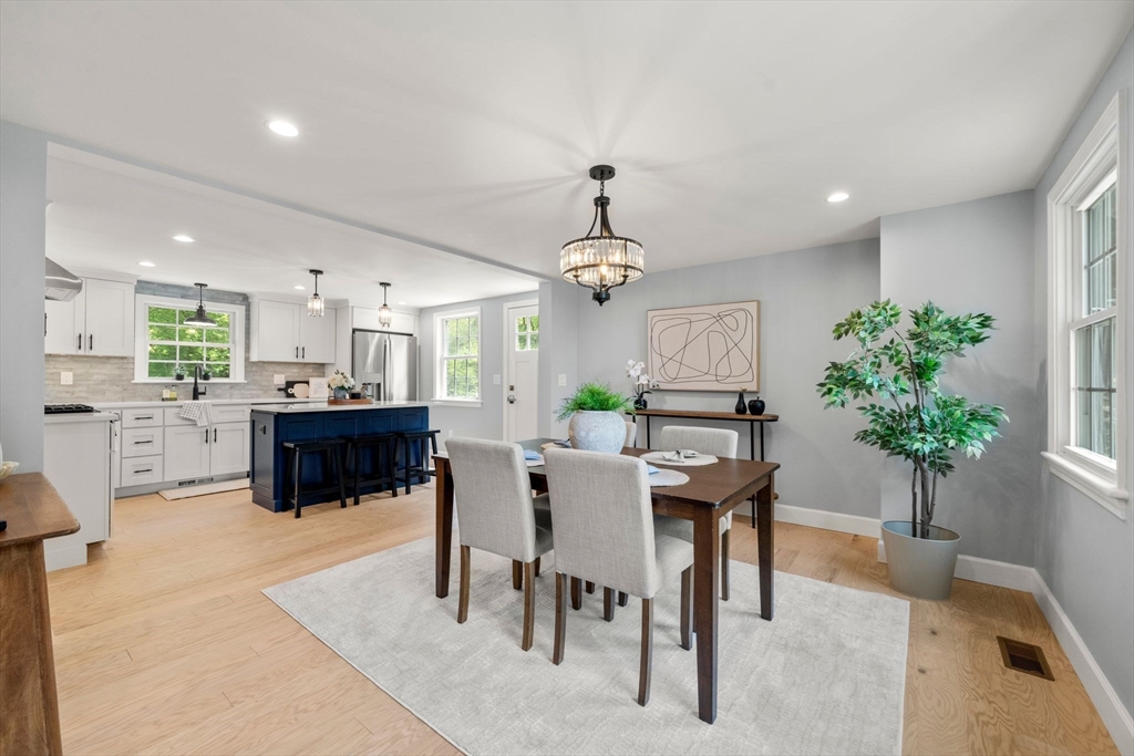 16 Churchill Road Plympton, MA 02367 - Photo 8 of 42 a living room with furniture potted plant and open kitchen view