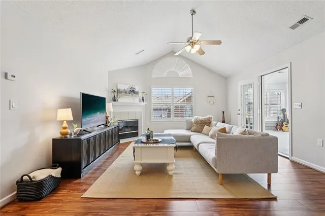 a living room with furniture and a flat screen tv
