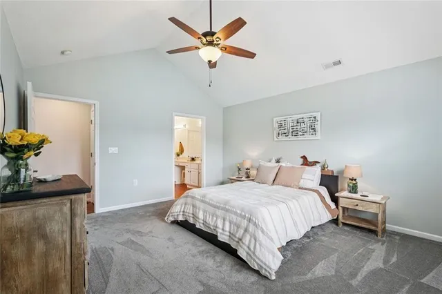 a bedroom with a bed and a potted plant
