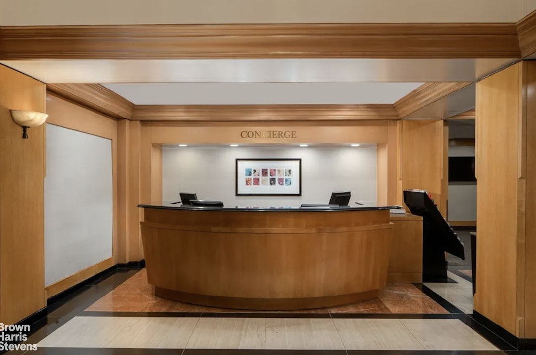 200 West 56th Street, Unit 1705 Manhattan, NY 10019 - Photo 10 of 12 a view of a living room with furniture