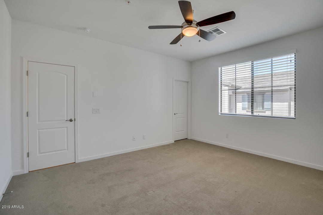 3900 East Baseline Road, Unit 114 Phoenix, AZ 85042 - Photo 15 of 31 a view of an empty room with a window