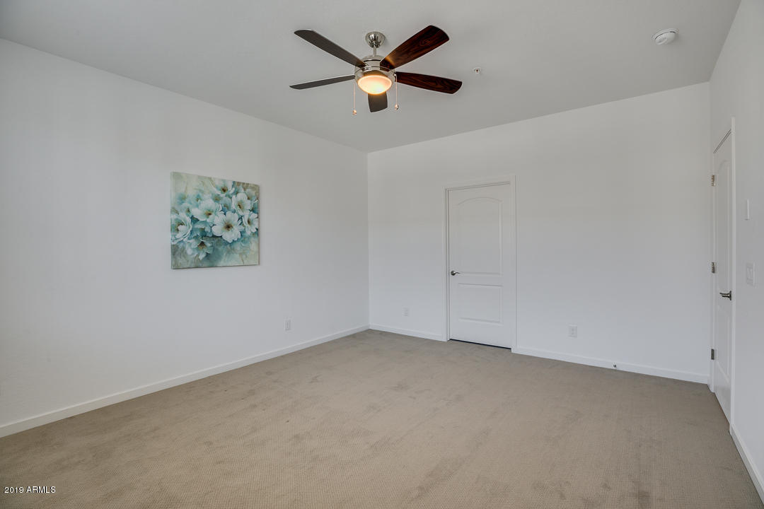3900 East Baseline Road, Unit 114 Phoenix, AZ 85042 - Photo 17 of 31 wooden floor in an empty room