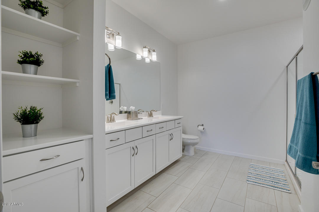 3900 East Baseline Road, Unit 114 Phoenix, AZ 85042 - Photo 19 of 31 a spacious bathroom with a double vanity sink and a mirror