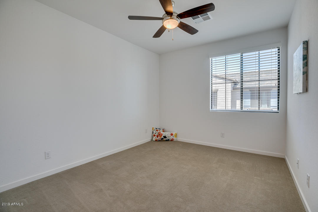 3900 East Baseline Road, Unit 114 Phoenix, AZ 85042 - Photo 23 of 31 an empty room with a window