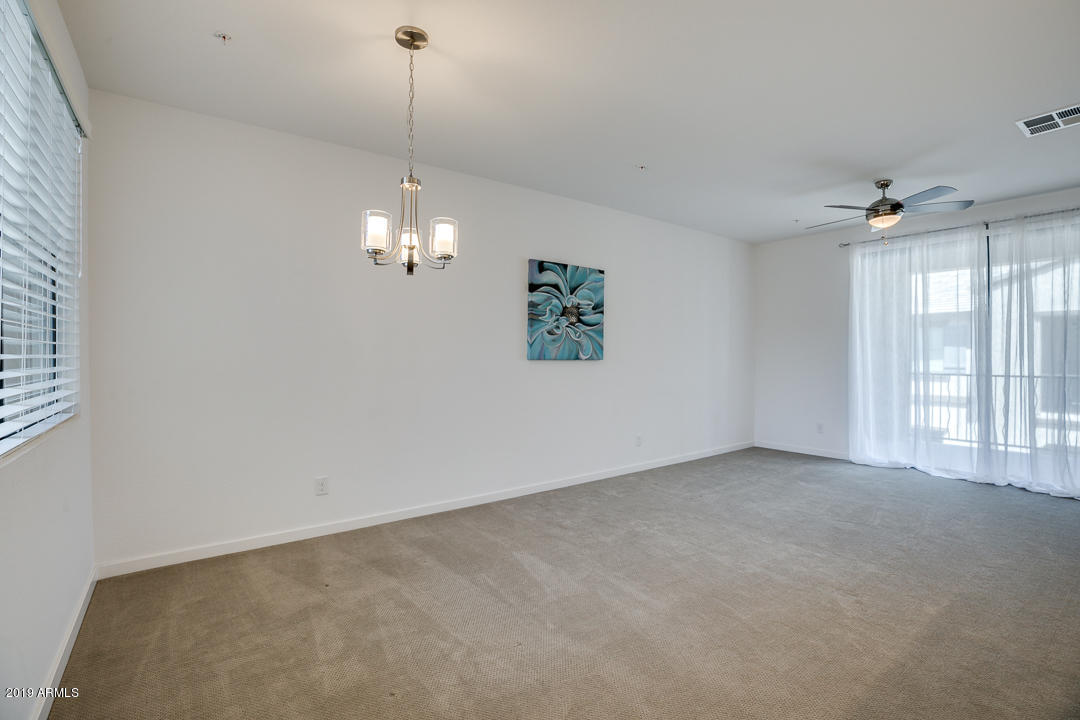 3900 East Baseline Road, Unit 114 Phoenix, AZ 85042 - Photo 4 of 31 a view of a room with window and chandelier