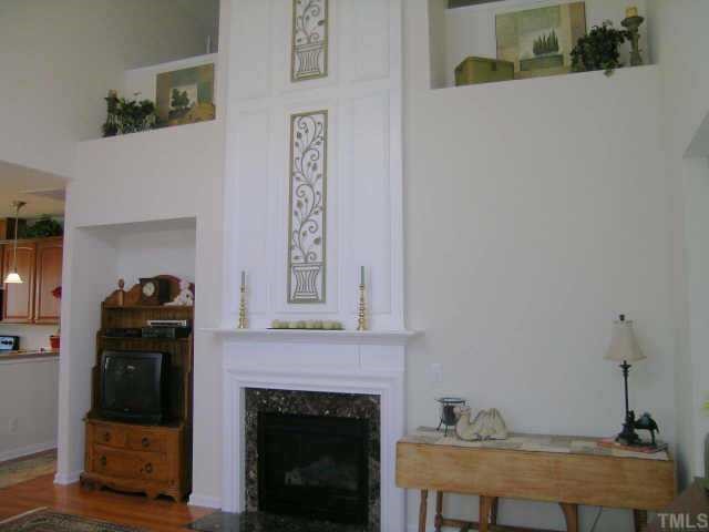 3405 Parlor Street Raleigh, NC 27614 - Photo 3 of 10 a living room with furniture and a fireplace