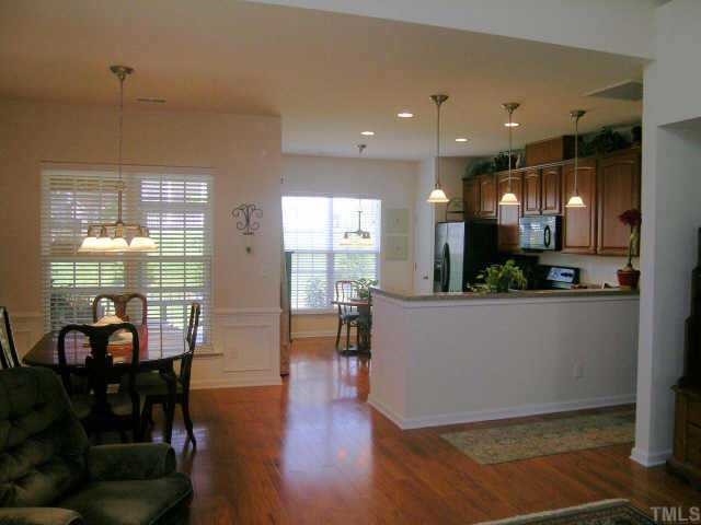 3405 Parlor Street Raleigh, NC 27614 - Photo 5 of 10 a view of a dining room with furniture window and wooden floor