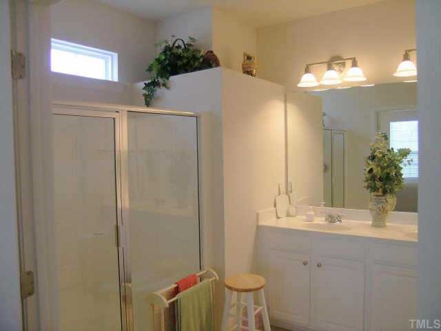 3405 Parlor Street Raleigh, NC 27614 - Photo 7 of 10 a bathroom with a sink toilet and shower