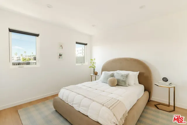 a bathroom with a granite countertop toilet a sink and a bathtub