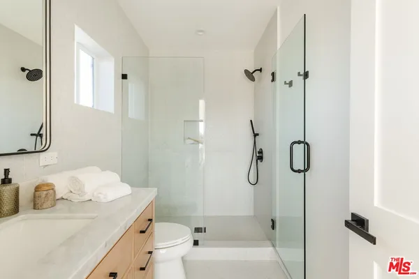 a balcony view with a rug and a table