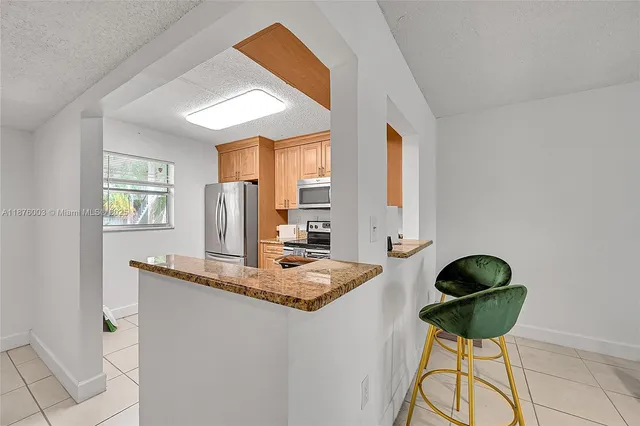 a workspace with furniture and chandelier