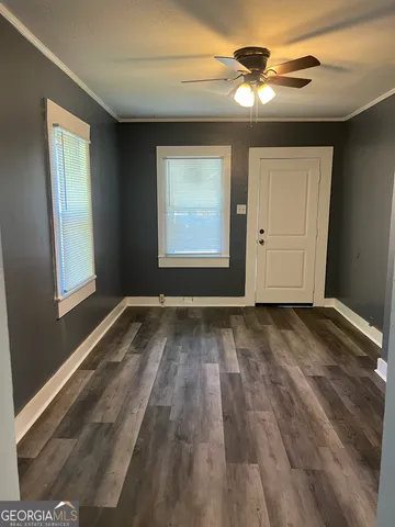 a view of room window and wooden floor