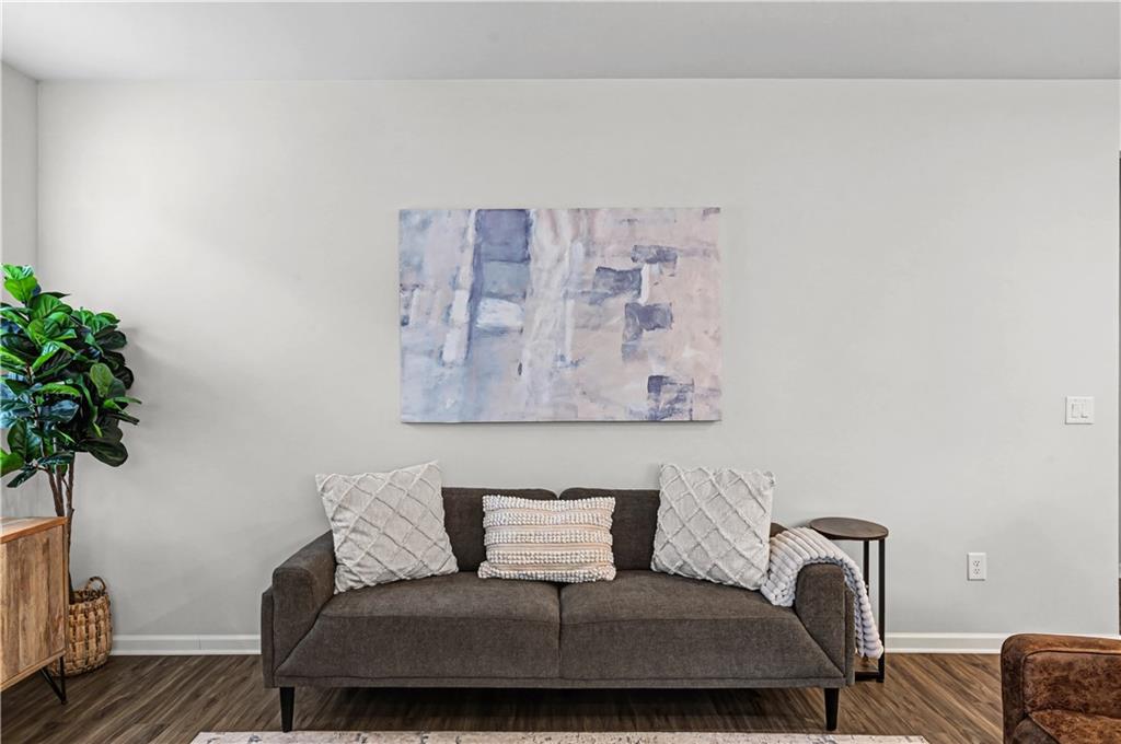 33 Brookside Way Cartersville, GA 30121 - Photo 12 of 54 a living room with furniture and a potted plant