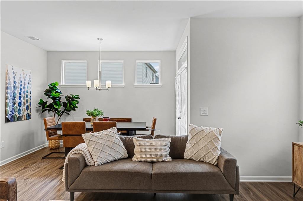 33 Brookside Way Cartersville, GA 30121 - Photo 16 of 54 a living room with furniture flowerpot and wooden floor