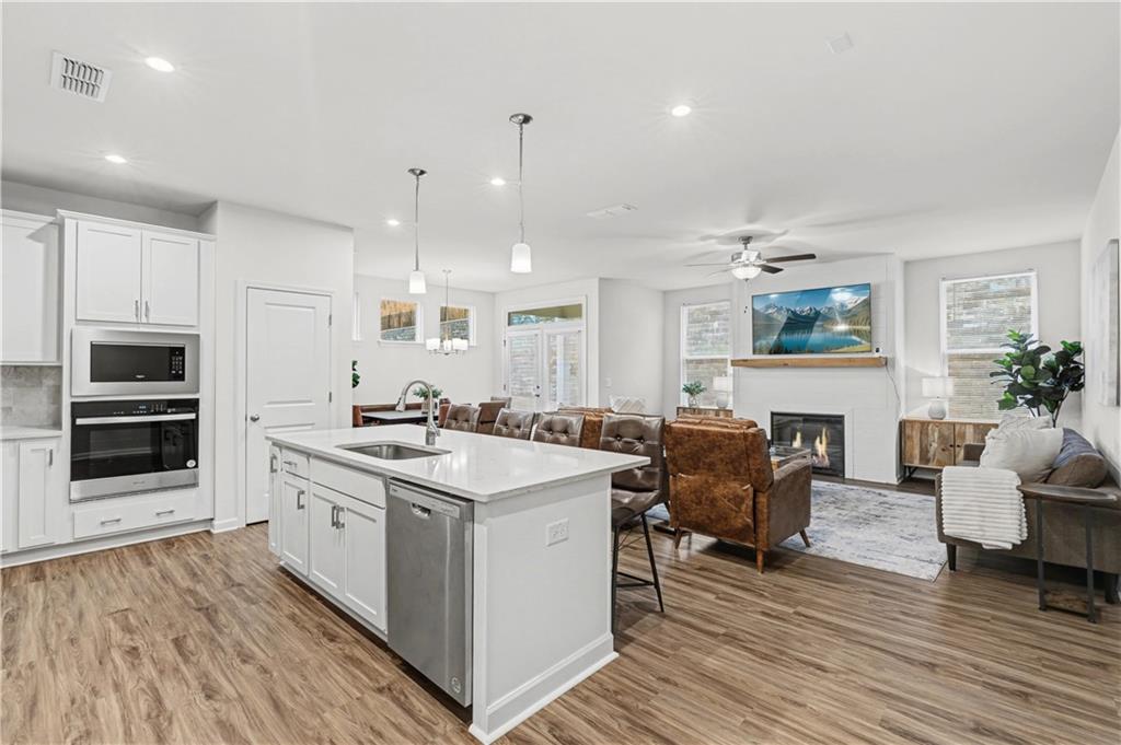 33 Brookside Way Cartersville, GA 30121 - Photo 21 of 54 a kitchen with a stove a sink and a refrigerator