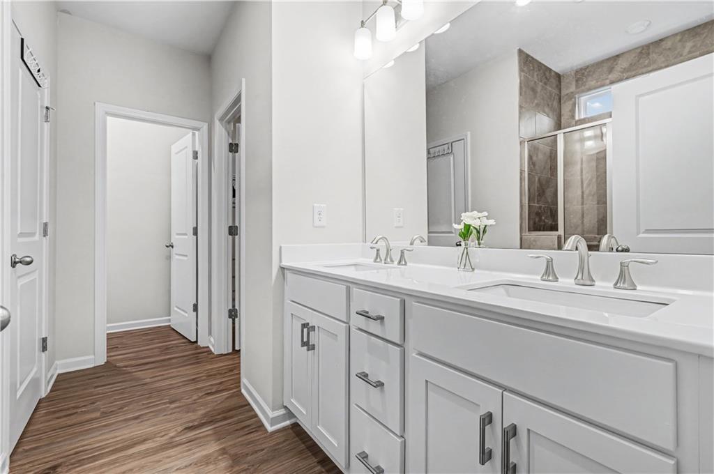 33 Brookside Way Cartersville, GA 30121 - Photo 27 of 54 a bathroom with a double vanity sink and a mirror