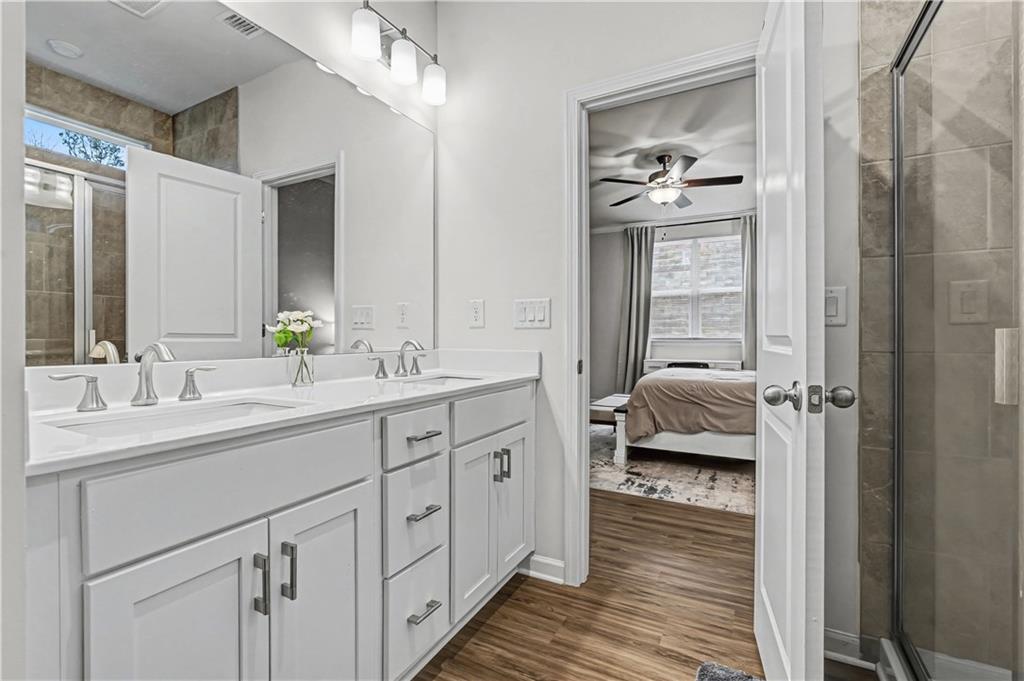 33 Brookside Way Cartersville, GA 30121 - Photo 30 of 54 a en suite bathroom with a double vanity sink and mirror