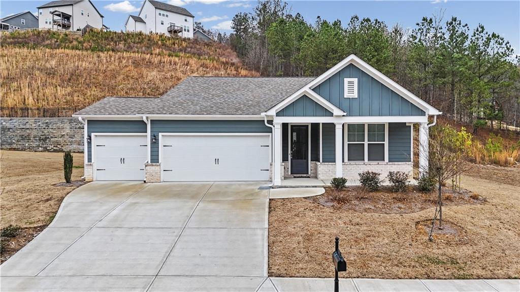 33 Brookside Way Cartersville, GA 30121 - Photo 51 of 54 a front view of a house with a garden and yard