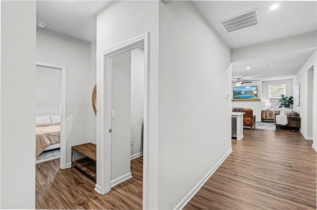 33 Brookside Way Cartersville, GA 30121 - Photo 8 of 54 a view of a hallway view with living room and wooden floor