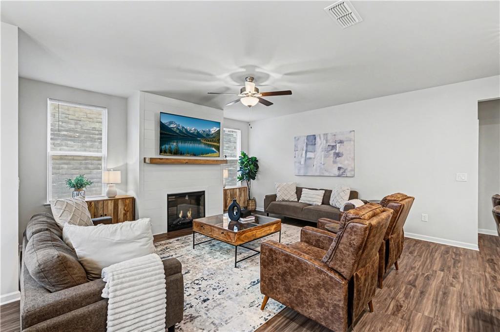 33 Brookside Way Cartersville, GA 30121 - Photo 10 of 54 a living room with furniture a fireplace and a flat screen tv