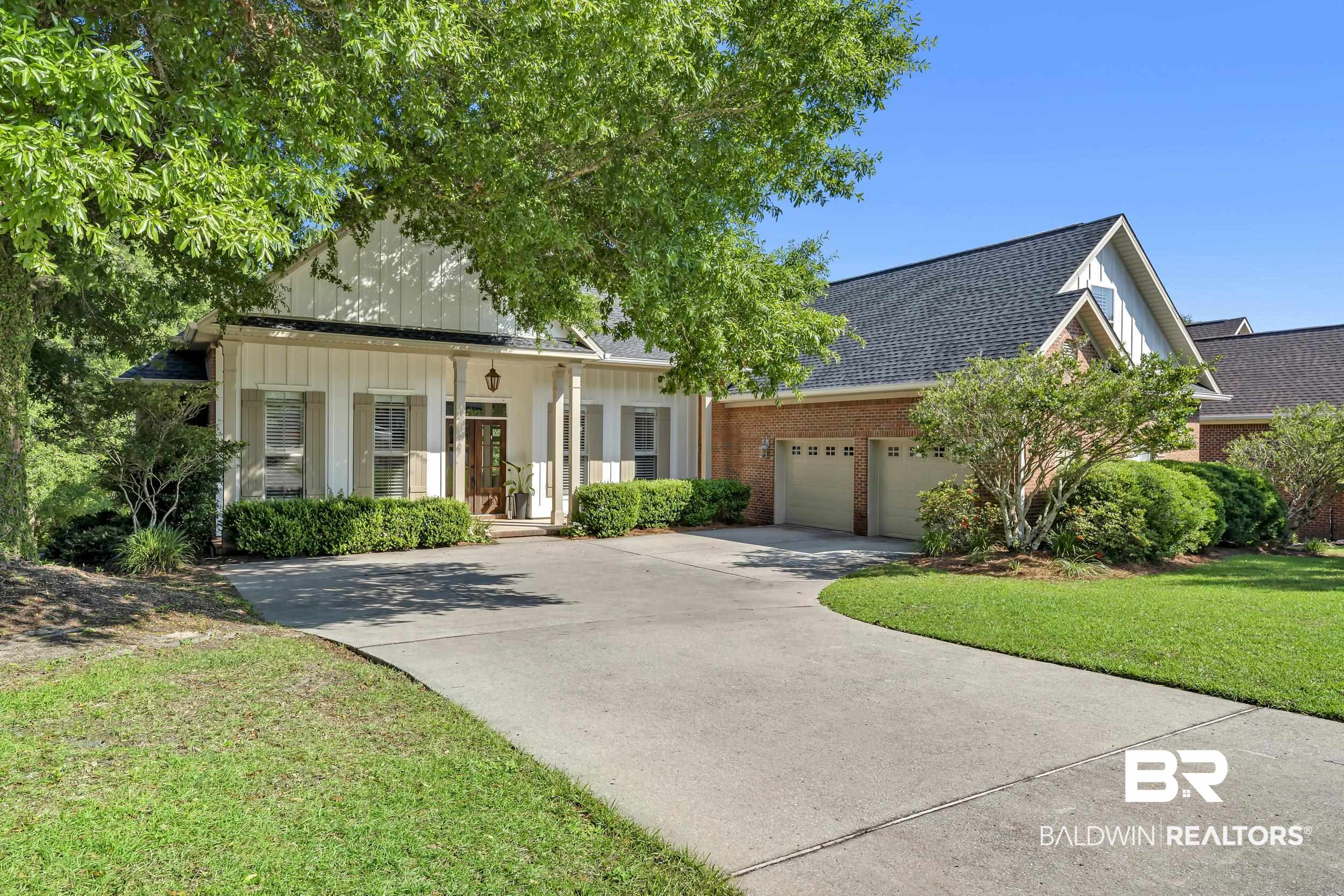 8137 Pine Run Daphne, AL 36527 - Photo 5 of 67 Charming exterior featuring a prominent gabled roofline, board and batten siding, and a covered entry porch