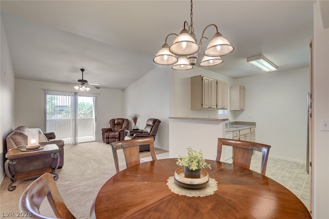 555 East Silverado Ranch Boulevard, Unit 2124 Las Vegas, NV 89183 - Photo 13 of 47 Vast vaulted ceilings complement an open layout, ideal for casual dining and comfortable living.