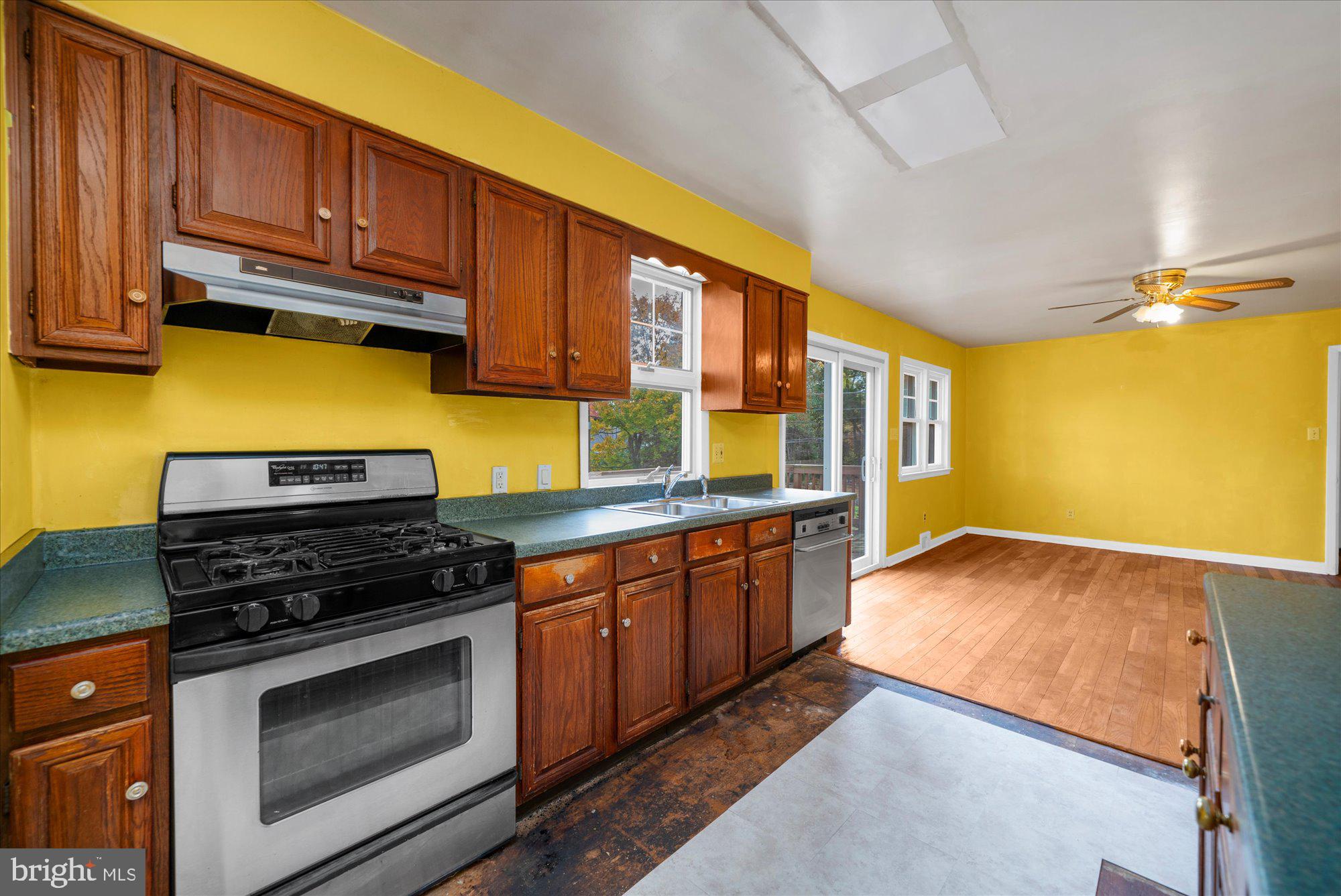 821 Coopertown Road Bryn Mawr, PA 19010 - Photo 13 of 44 a kitchen with stainless steel appliances granite countertop a stove a sink and a microwave