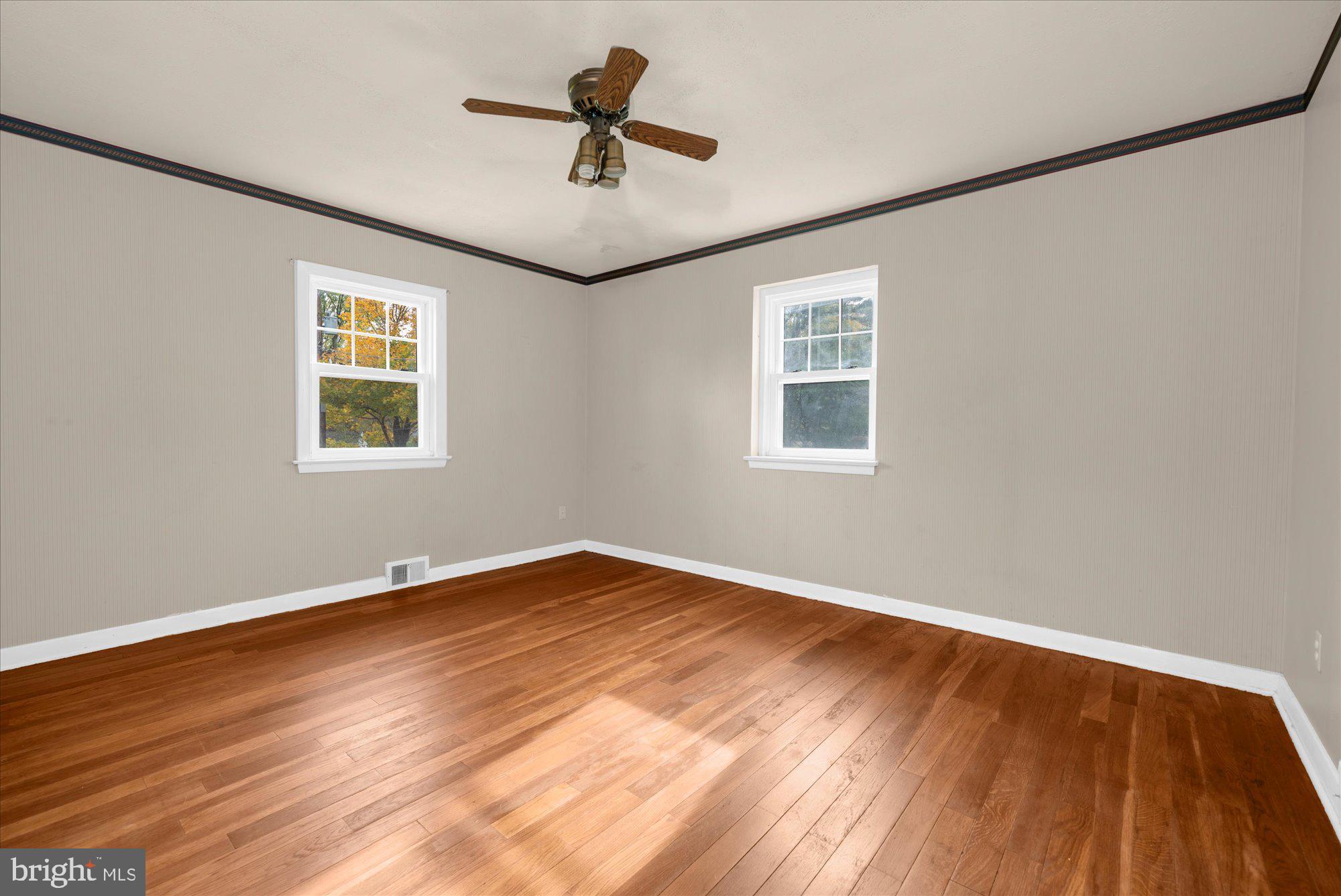 821 Coopertown Road Bryn Mawr, PA 19010 - Photo 17 of 44 a view of empty room with wooden floor and fan