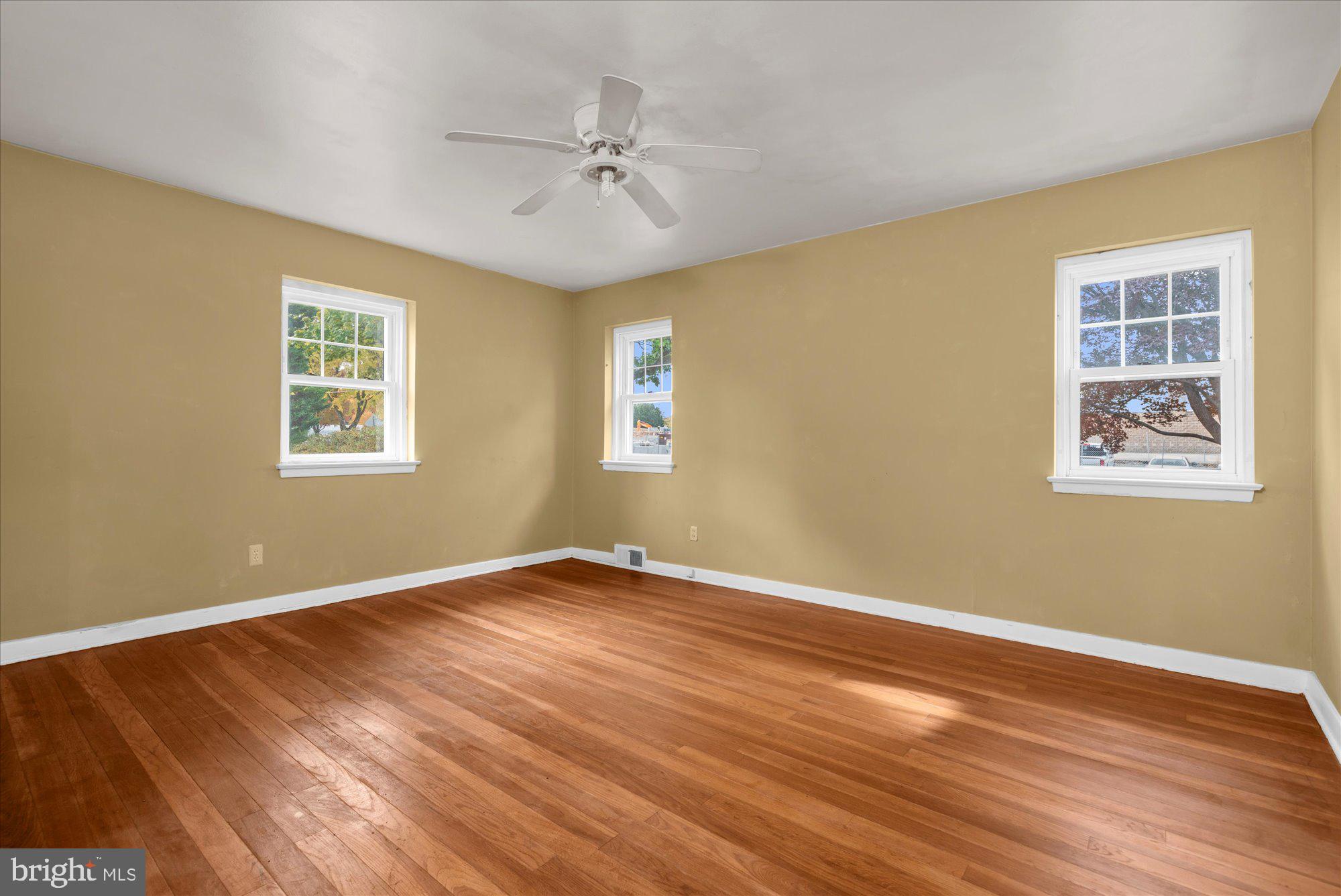 821 Coopertown Road Bryn Mawr, PA 19010 - Photo 19 of 44 a view of an empty room with wooden floor and a window