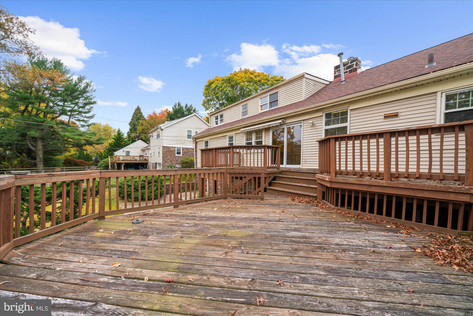 821 Coopertown Road Bryn Mawr, PA 19010 - Photo 36 of 44 a view of a house with a wooden deck