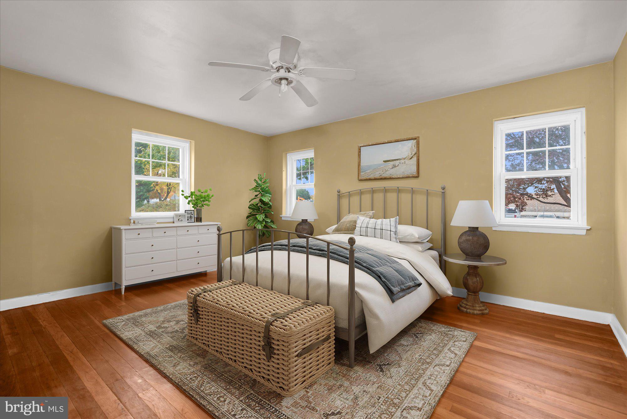 821 Coopertown Road Bryn Mawr, PA 19010 - Photo 4 of 44 a bedroom with a bed and wooden floor