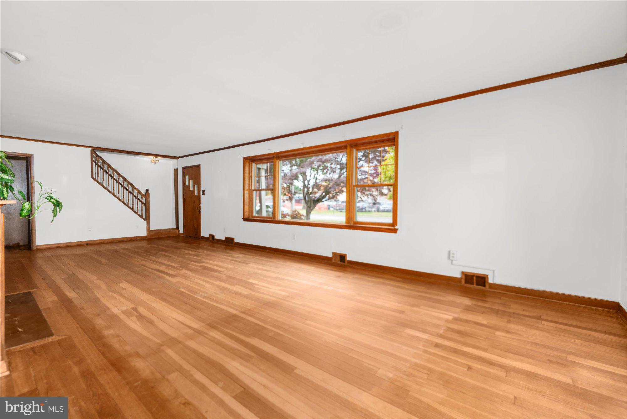 821 Coopertown Road Bryn Mawr, PA 19010 - Photo 8 of 44 an empty room with wooden floor and windows