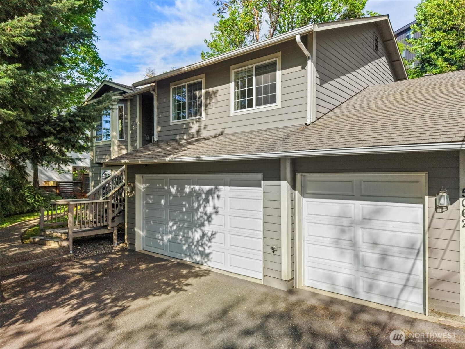 5062 23rd Avenue Southwest Seattle, WA 98106 - Photo 1 of 39 a front view of a house with parking