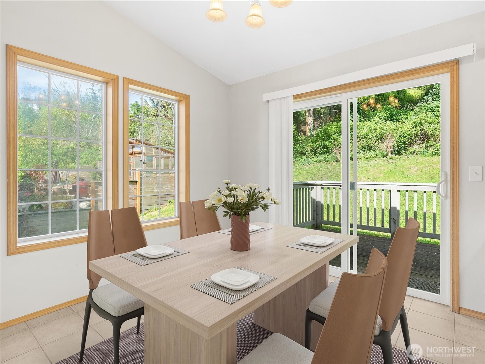 5062 23rd Avenue Southwest Seattle, WA 98106 - Photo 11 of 39 a view of a dining room with furniture window and outside view