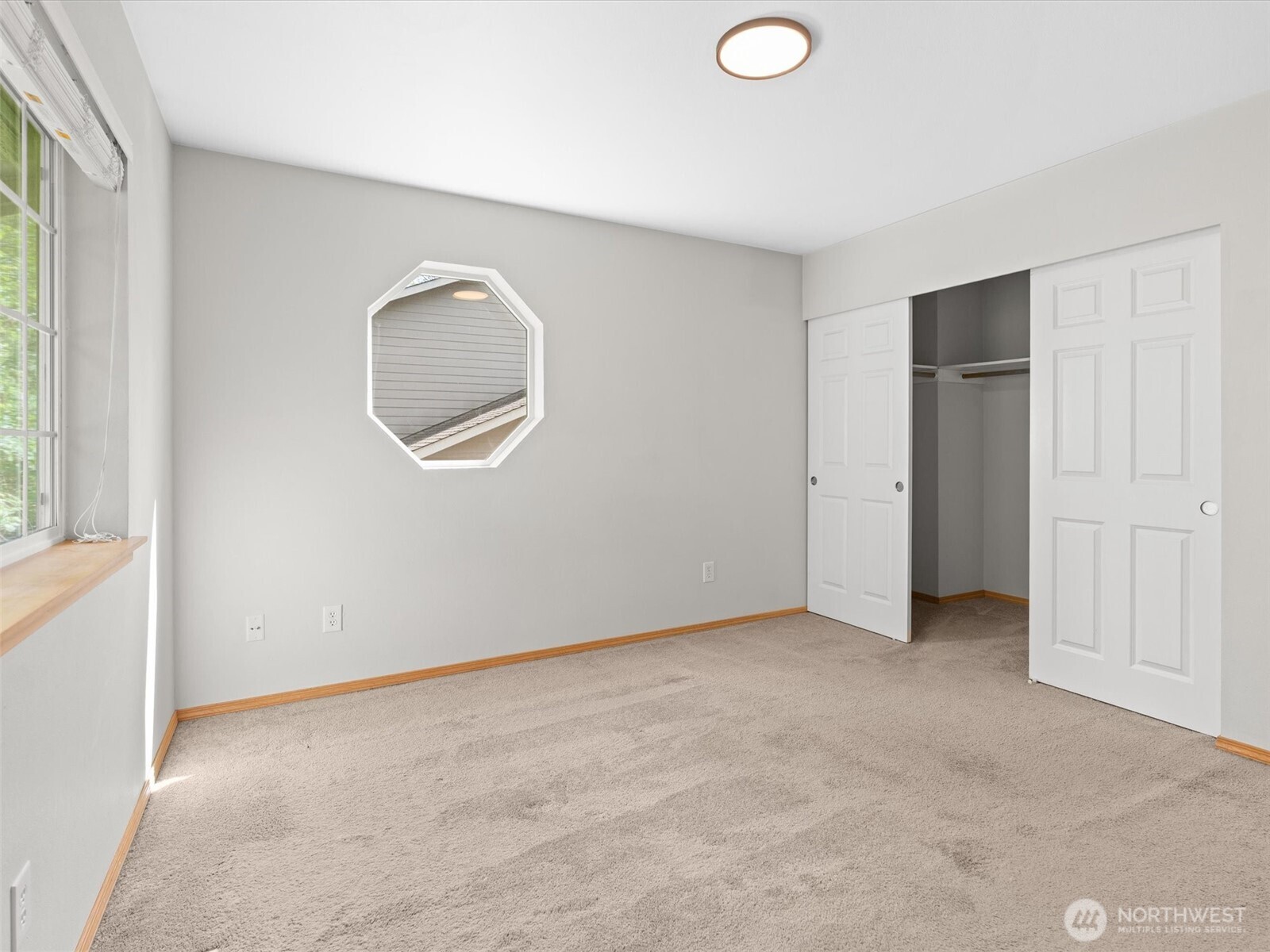 5062 23rd Avenue Southwest Seattle, WA 98106 - Photo 24 of 39 an empty room with window and closet