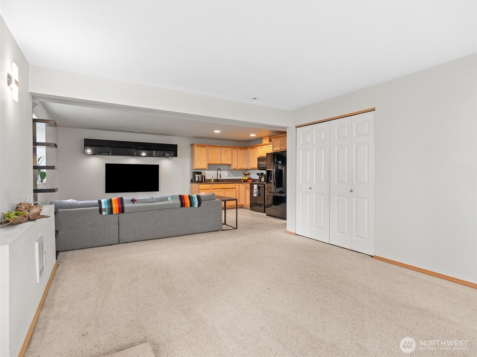5062 23rd Avenue Southwest Seattle, WA 98106 - Photo 28 of 39 a living room with furniture and a flat screen tv