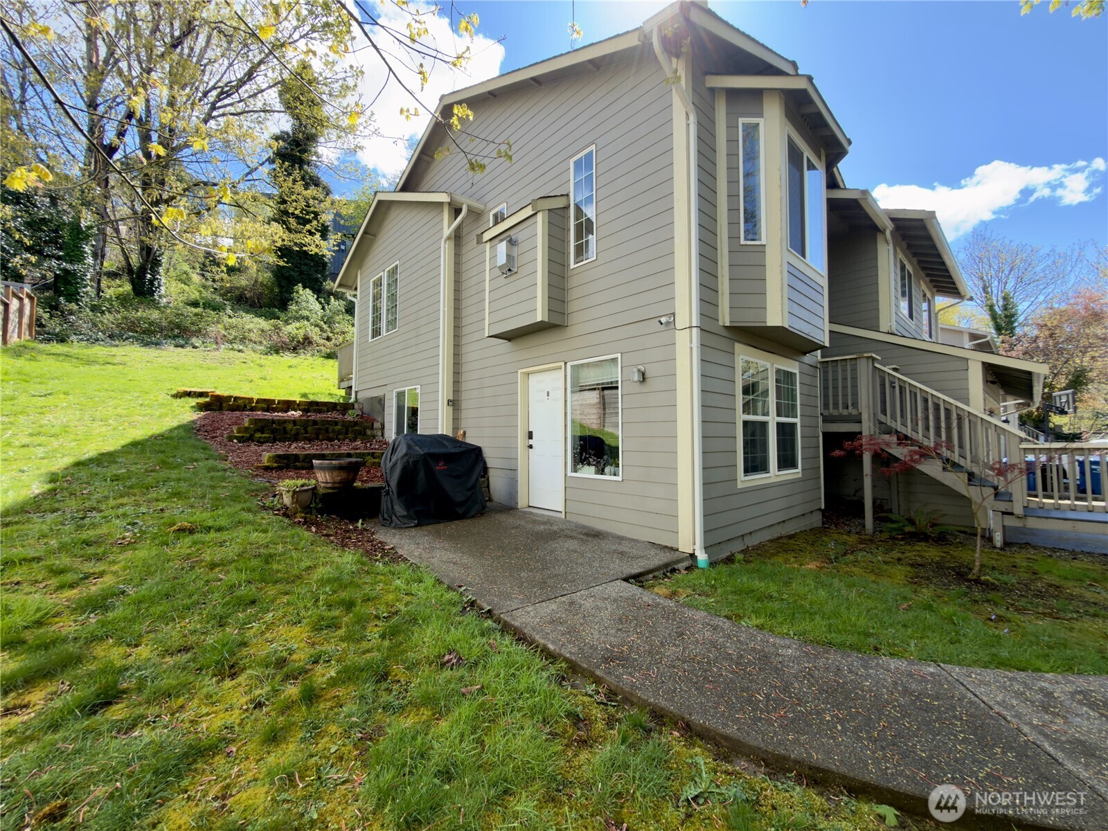 5062 23rd Avenue Southwest Seattle, WA 98106 - Photo 37 of 39 a view of a house with backyard and sitting area